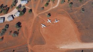 Aircraft parked in the red dirt of Outback Australia