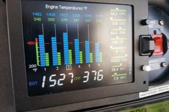 Aircraft engine instruments showing EGT and CHT temperatures